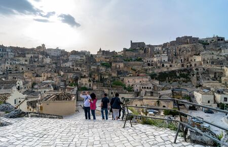 MATERA, ITALY - MAY 15, 2015: street view of Sassi di Matera ancient town with tourists in Matera, Italy. The city is a UNESCO World Heritage site and European Capital of Culture for 2019.のeditorial素材