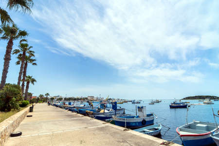 PORTO CESAREO, ITALY - MAY 17, 2015: day view of boats and coastline in Porto Cesareo, Italy. Apulia beaches are among the finest in the whole country of Italy.のeditorial素材