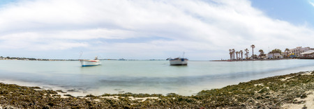 long exposure of mediterranean sea and coastline in Porto Cesareo, Italyの写真素材