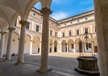 Urbino, Italy - August 14, 2015: Ducal Palace courtyard with tourists in Urbino, Italy.のeditorial素材