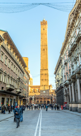 Bologna, Italy - December 27, 2015: street view with famous Two Towers in Bologna, Italy. The two medieval towers, named Asinelli and Garisella, are the landmark of the city.のeditorial素材