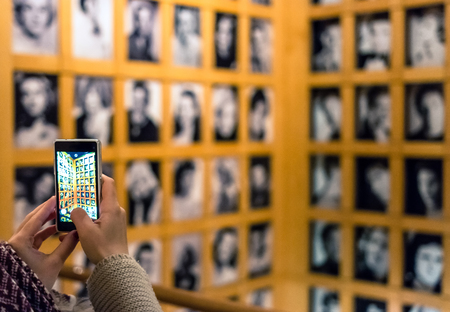 Turin, Italy - January 01, 2016: tourist takes picture with smartphone at National Museum of Cinema...