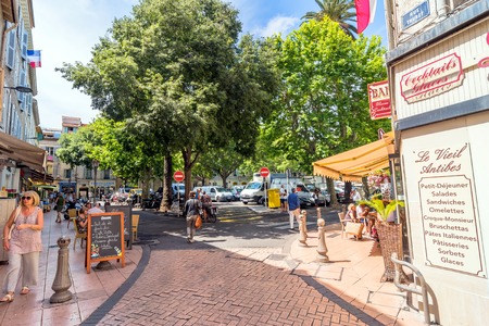Antibes, France - June 29, 2016: day view of typical dowmtown street in Antibes, France. Antibes is a popular seaside town in the heart of the Cote d'Azur.のeditorial素材