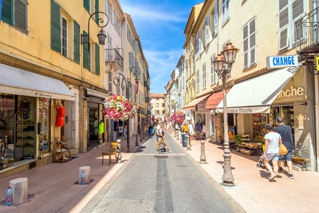 Antibes, France - June 29, 2016: day view of typical narrow street in Antibes, France. Antibes is a popular seaside town in the heart of the Cote d'Azur.のeditorial素材
