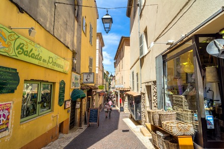 Antibes, France - June 29, 2016: day view of typical narrow street in Antibes, France. Antibes is a popular seaside town in the heart of the Cote d'Azur.のeditorial素材