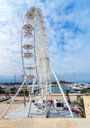Antibes, France - July 01, 2016: day view of port Vauban and grande roue in Antibes, France. Port Vauban is the largest marina in the Mediterranean Sea.のeditorial素材