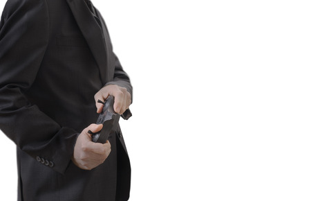 A man is holding a remote control in his hands, isolated on white backgroundの写真素材