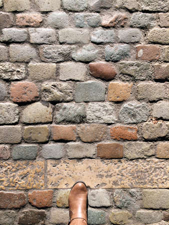 Cobblestone street walker stone under the sunの写真素材