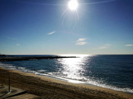 Late dawn on beach deserted Mediterranean coastの写真素材