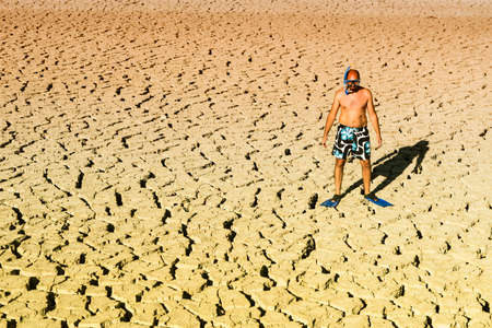 a boy with snorkel and fins in the fieldの写真素材