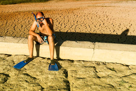 a boy with snorkel and fins in the fieldの写真素材