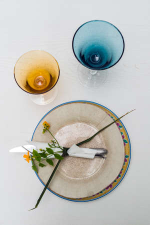 cutlery and table decorated with flowers