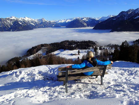 magical winter landscape with fog inversion - in the Alps - Vorarlberg Austriaの写真素材