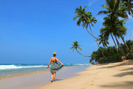 pretty girl on a dream beach with palm trees - Sri Lanka, Asiaの写真素材