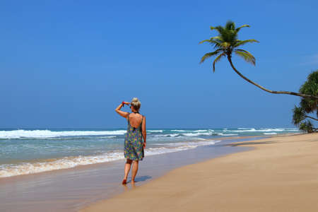 pretty girl on a dream beach with palm trees - Sri Lanka, Asiaの写真素材