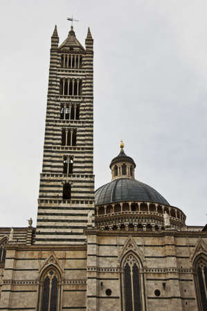 Duomo Cathedral facade is the most important church in Siena, symbol fo italian gothic style, located in the historical city of Siena in Tuscany, Italy の写真素材