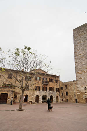 SAN GIMIGNANO, ITALY - APRIL 04  view of Piazza del Duomo on April 04, 2012 in San Gimignano, Italy  The medieval town of San Gimignano is one of the most famous turist attraction in Tuscany  のeditorial素材