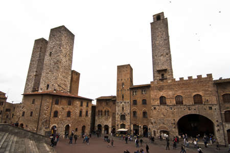 SAN GIMIGNANO, ITALY - APRIL 04: view of Piazza del Duomo on April 04, 2012 in San Gimignano, Italy. The medieval town of San Gimignano is one of the most famous turist attraction in Tuscany. のeditorial素材