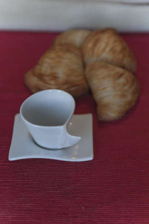 croissant and coffee cup at breakfastの写真素材