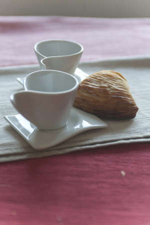 croissant and coffee cup at breakfast