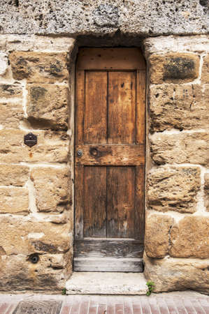 door of the old building in italian village of tuscany, italyの写真素材