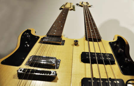 details of a guitar and bass guitar 
