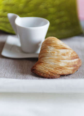croissant and coffee cup at breakfastの写真素材