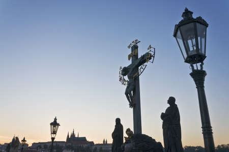 statues on St. Charles bridge in Prague, Czech Republicの写真素材