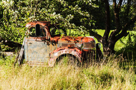 old wrecking car in countryside in Maine, Usaの写真素材