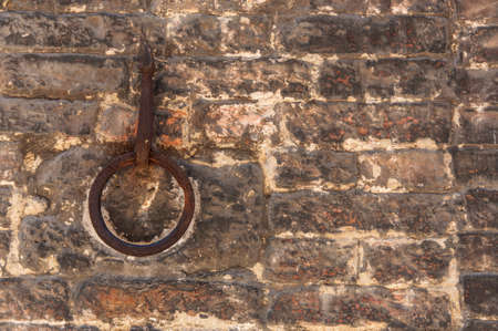old horse hook on the wall of Siena, Italyの写真素材