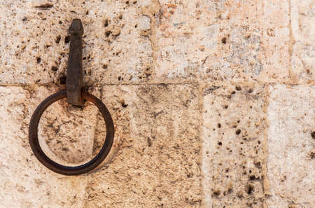 old horse hook on the wall of Siena, Italyの写真素材