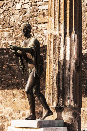 bronze statue inside the pompeii ruins, italyの写真素材