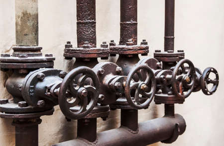a a group of key pipelines inside a factoryの写真素材