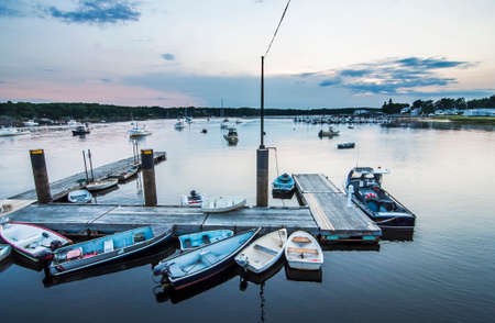 pier and boats at susnet in Camp Ellis, Maine Usaの写真素材