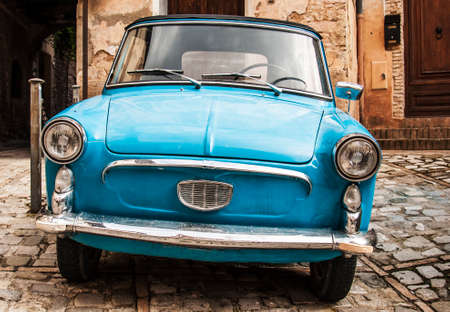old style italian car in a village in Central Italyの写真素材