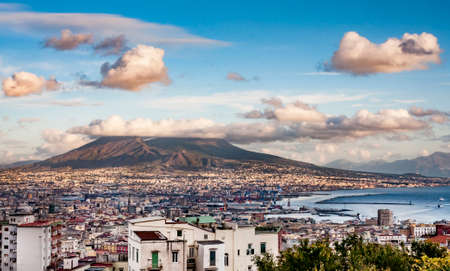 NAPLES - DECEMBER 4: Naples and mount Vesuvius in the background at sunset in a winter day on December 4, 2011 in Naples, Italyのeditorial素材