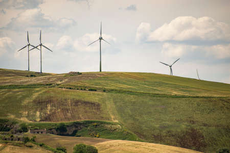 series of wind turbines on the italian landsdapeの写真素材