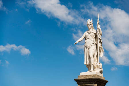 view of the ancient statue of liberty against the bright blue sky in San Marino Republicの写真素材