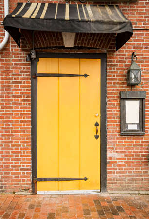 Door of a typical New England residential house with small entrance gardenの写真素材
