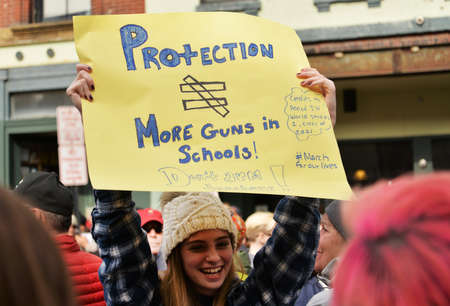 Portland, ME - March 24, 2018: National School Walkout Student Protester Holding Sign, on March 24,...