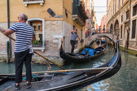 VENICE - JULY 1: beautiful view of the canal with a floating gondola on July 1, 2017 in Venice, Italyのeditorial素材