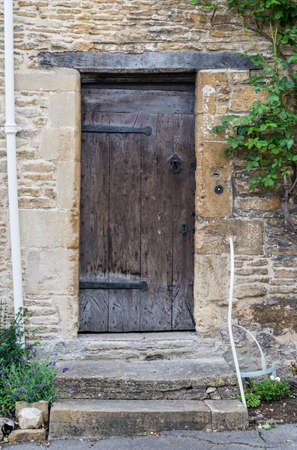 Old British door in an old village in south of Englandの写真素材