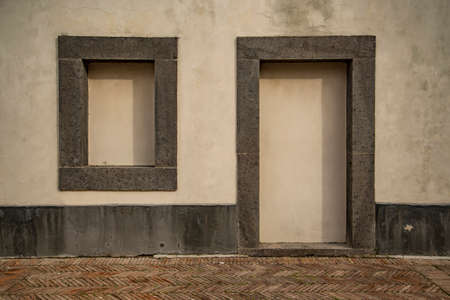 Old italian vintage blind door and window in Naples, Italyの写真素材