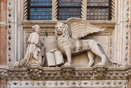 the Dodge duke palace facade with the lion symbol of the Republic in Saint Mark square in the beautiful city of Venice in Italyのeditorial素材