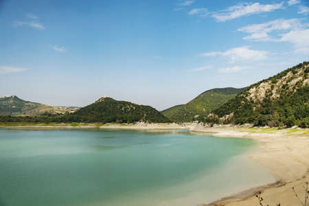 Lake Campotosto embedded in the Gran Sasso and Monti della Laga National Park, Abruzzo, Italyの写真素材