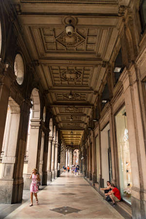BOLOGNA - JUNE 25: Medieval street portico with bright colored houses in the Old Town in the sunny day, on June 25, 2017 in Bologna, Emilia-Romagna, Italyのeditorial素材