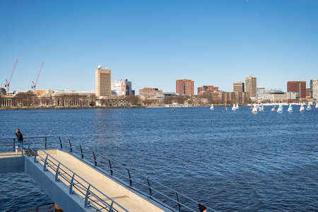 BOSTON, MA - MARCH 19, 2016: people play sport with city skyline on the background, in Boston,...