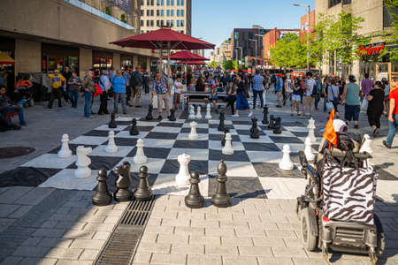 MONTREAL - CANADA, MAY 27, 2017: Giant Chess Set outdoors surrounded by people in the city centre of Montrealのeditorial素材