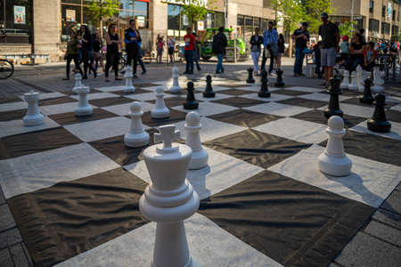 MONTREAL - CANADA, MAY 27, 2017: Giant Chess Set outdoors surrounded by people in the city centre of Montrealのeditorial素材