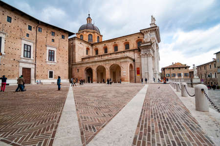 View of the facade and the cupola of the neoclassical Duomo di Urbino, Urbino Cathedral in the Marche region, Italy.のeditorial素材